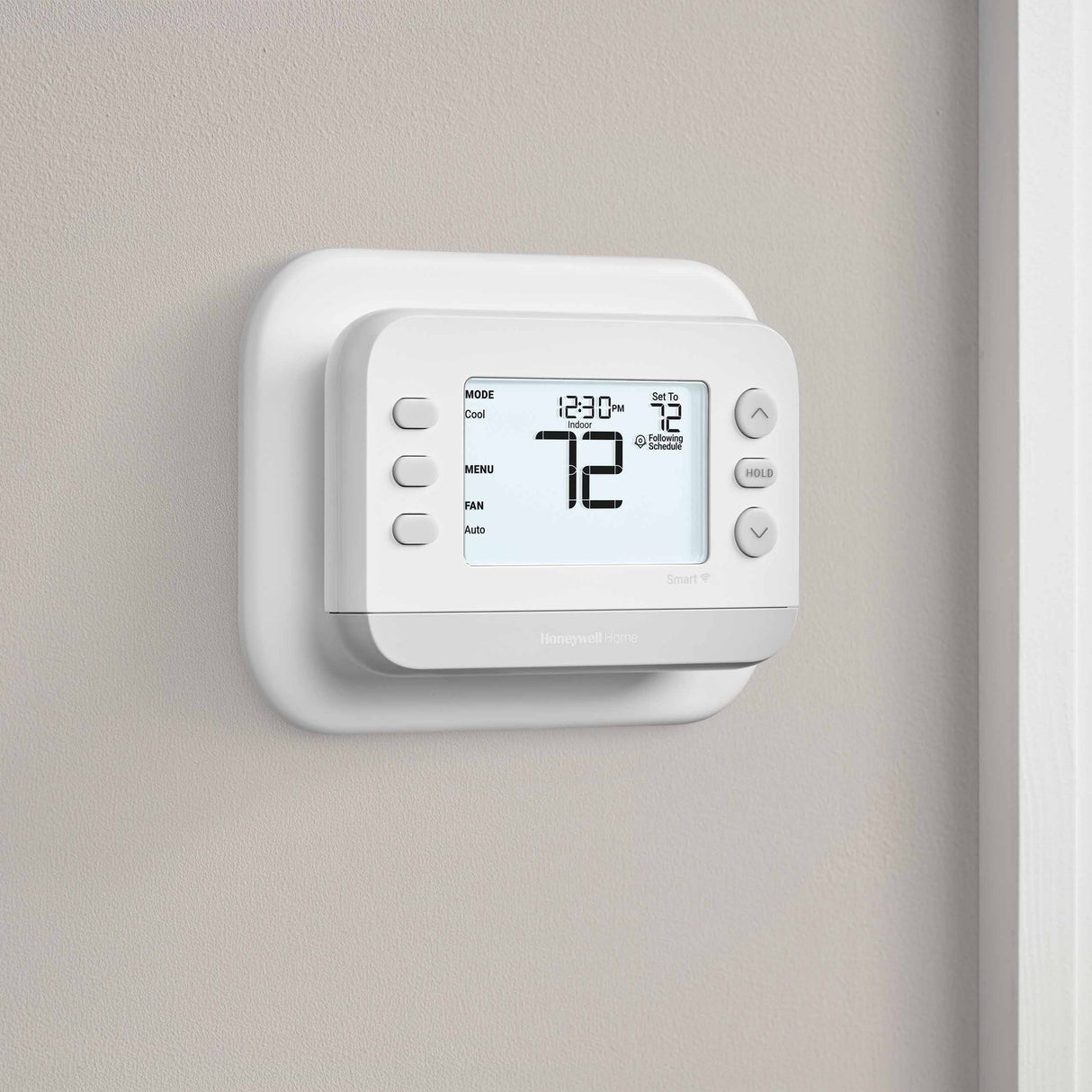 Thermostat Cover Plate Kit White with thermostat installed in room facing right