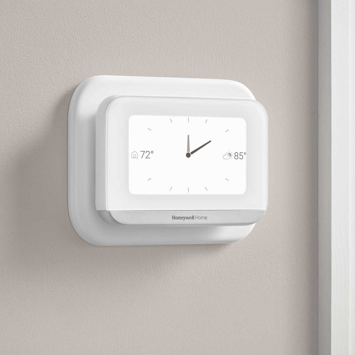 Thermostat Cover Plate Kit White with thermostat installed in room displaying clock