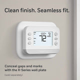 White X2S thermostat with white wall plate to cover old marks