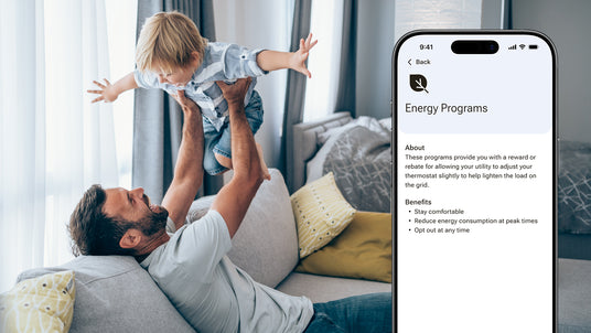 A smartphone displays benefits of energy programs with benefits and rewards on the Resideo Connect app.  A father plays with his son on their couch.