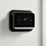Thermostat Cover Plate Kit Black with thermostat installed in room with clock
