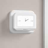 Thermostat Cover Plate Kit White with thermostat installed in room displaying clock
